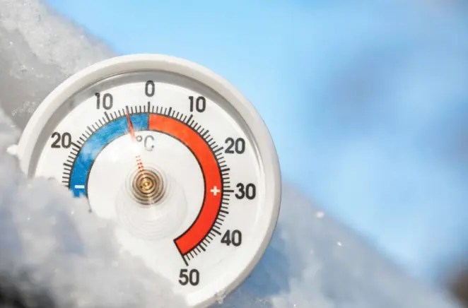 Outdoor thermometer showing freezing temperatures